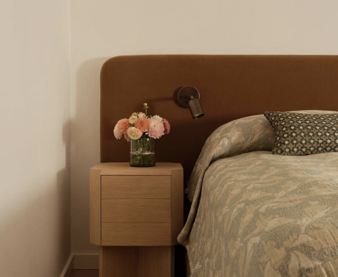 Sunlit living room with an air purifier and filtered water on a wooden side table
